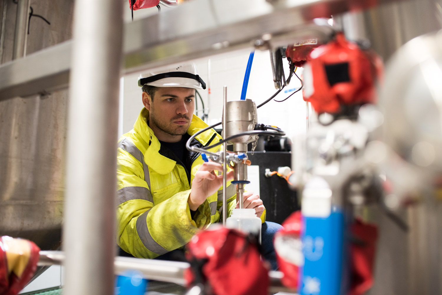 Colleague working with machinery