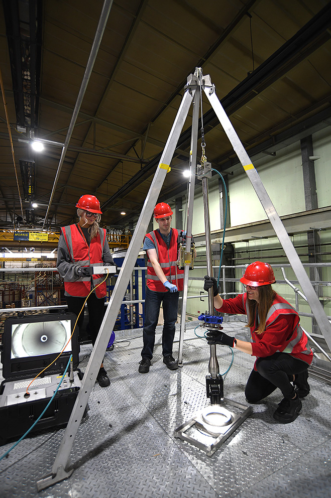 3 team members assembling equipment