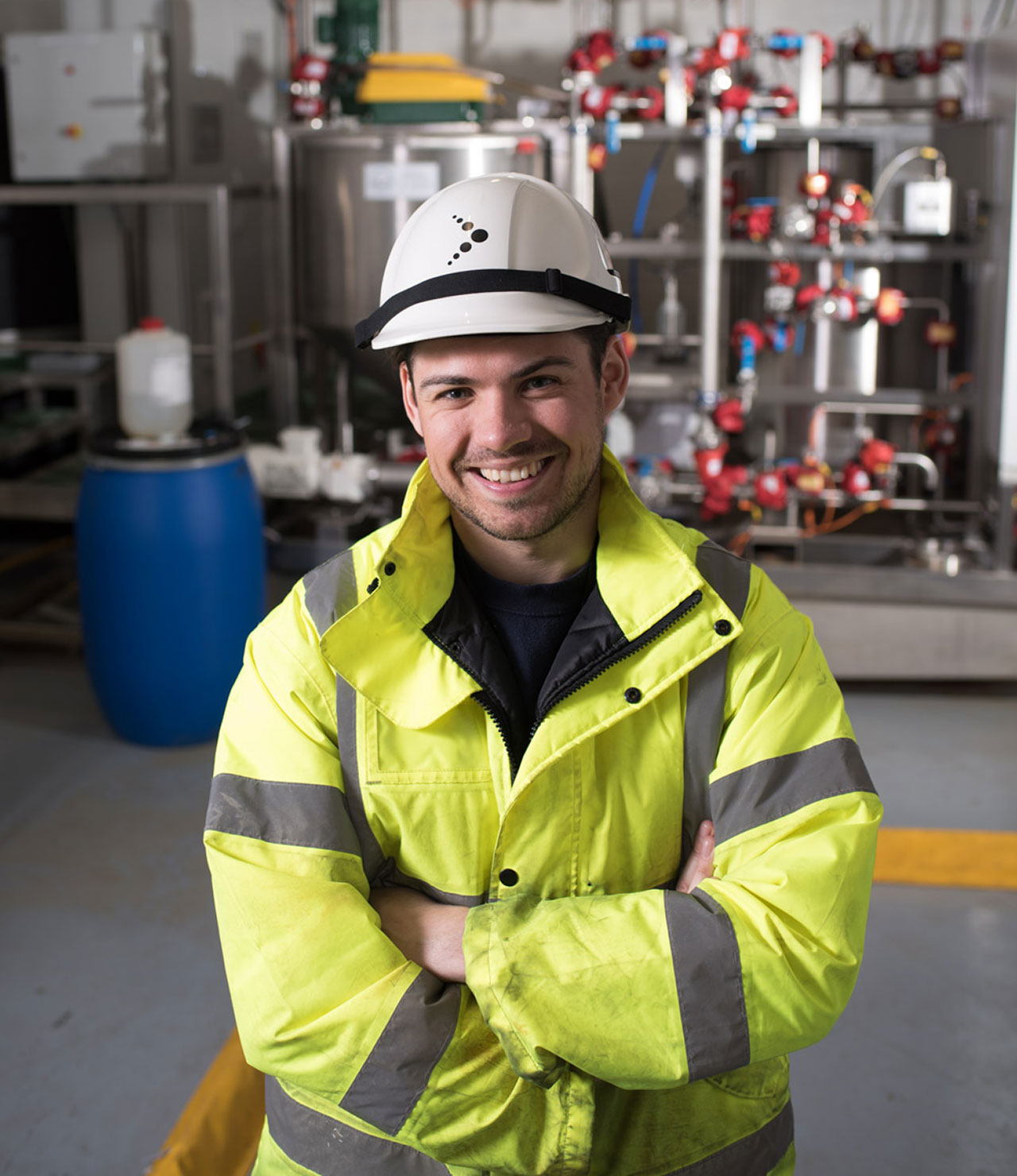Colleague with helmet and high vis jacket